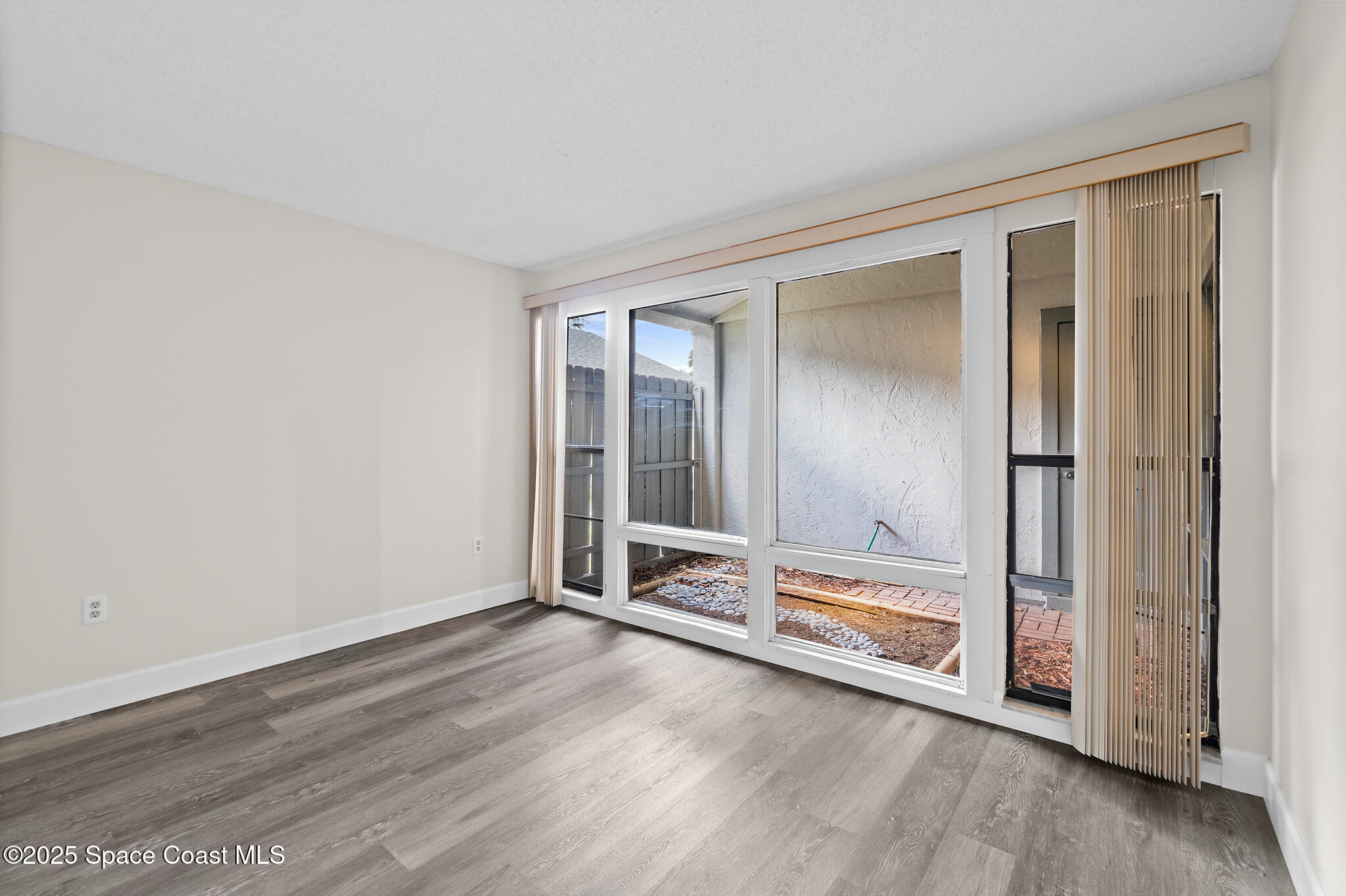 425 Willow Tree Drive Melbourne, FL 32940 - Photo 13 of 25 Bedroom 2 with Garden View