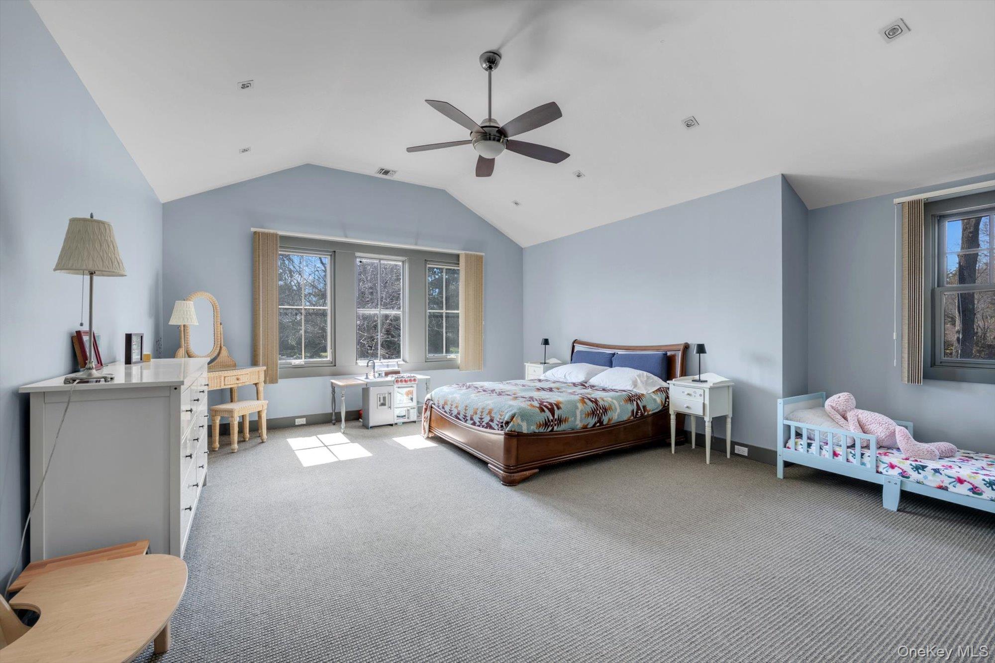 254 Adams Road Hewlett Harbor, NY 11557 - Photo 15 of 34 a spacious bedroom with a bed and a window