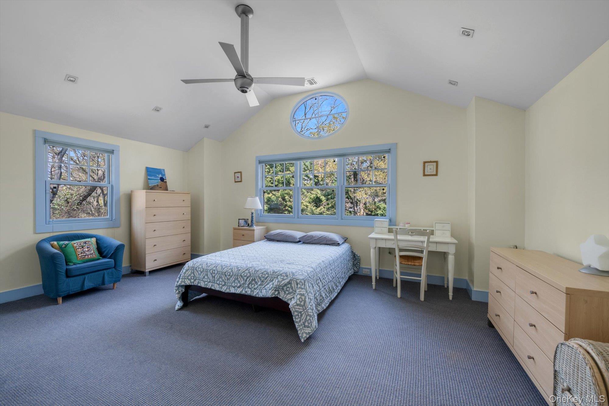 254 Adams Road Hewlett Harbor, NY 11557 - Photo 16 of 34 a bedroom with a bed and a table in it