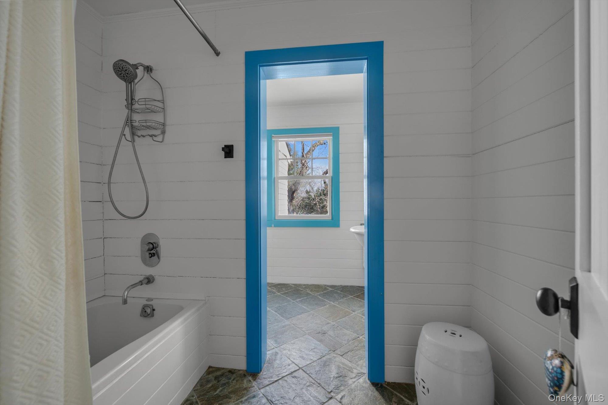 254 Adams Road Hewlett Harbor, NY 11557 - Photo 21 of 34 a bathroom with a bathtub and shower