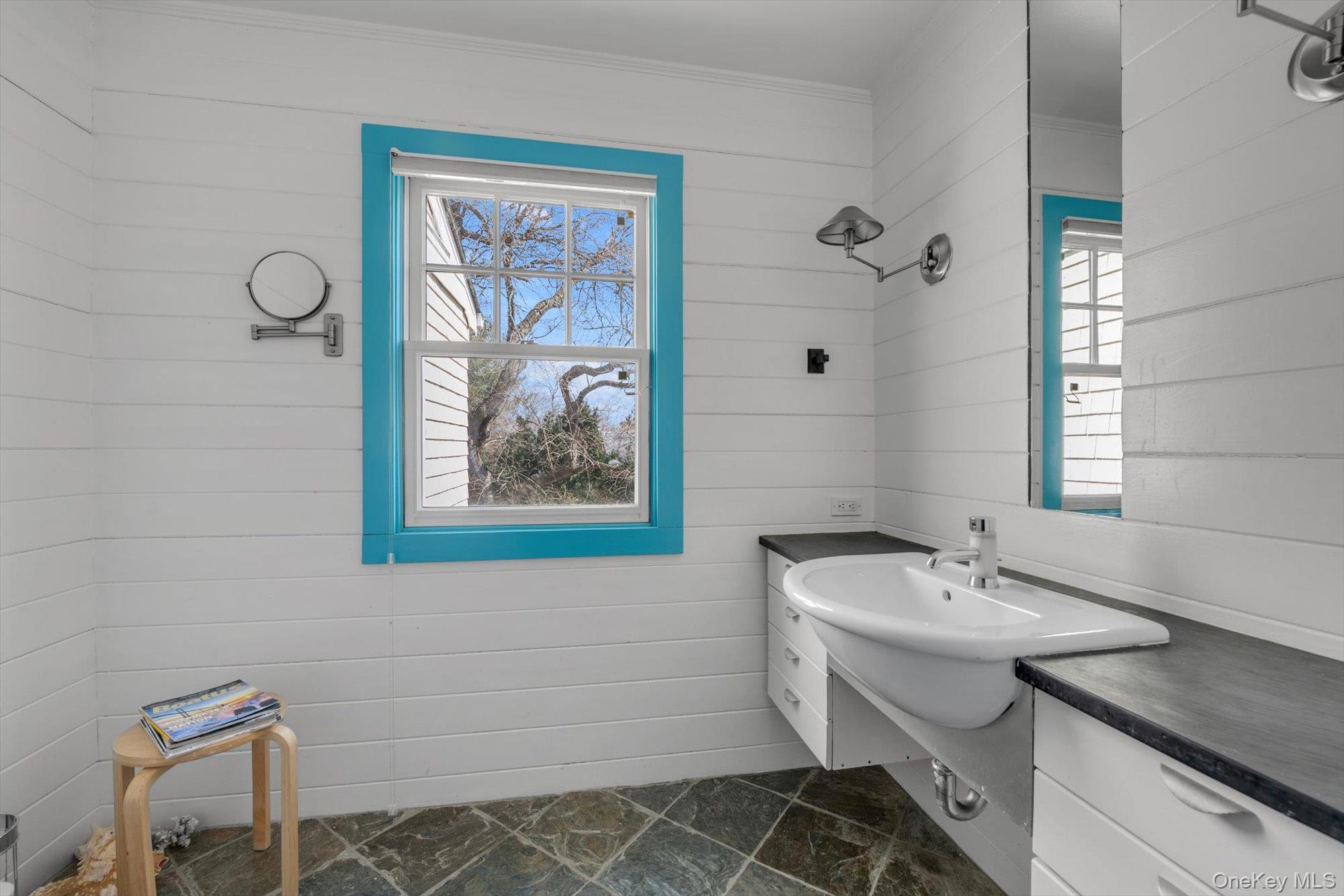 254 Adams Road Hewlett Harbor, NY 11557 - Photo 22 of 34 a bathroom with a sink and a mirror