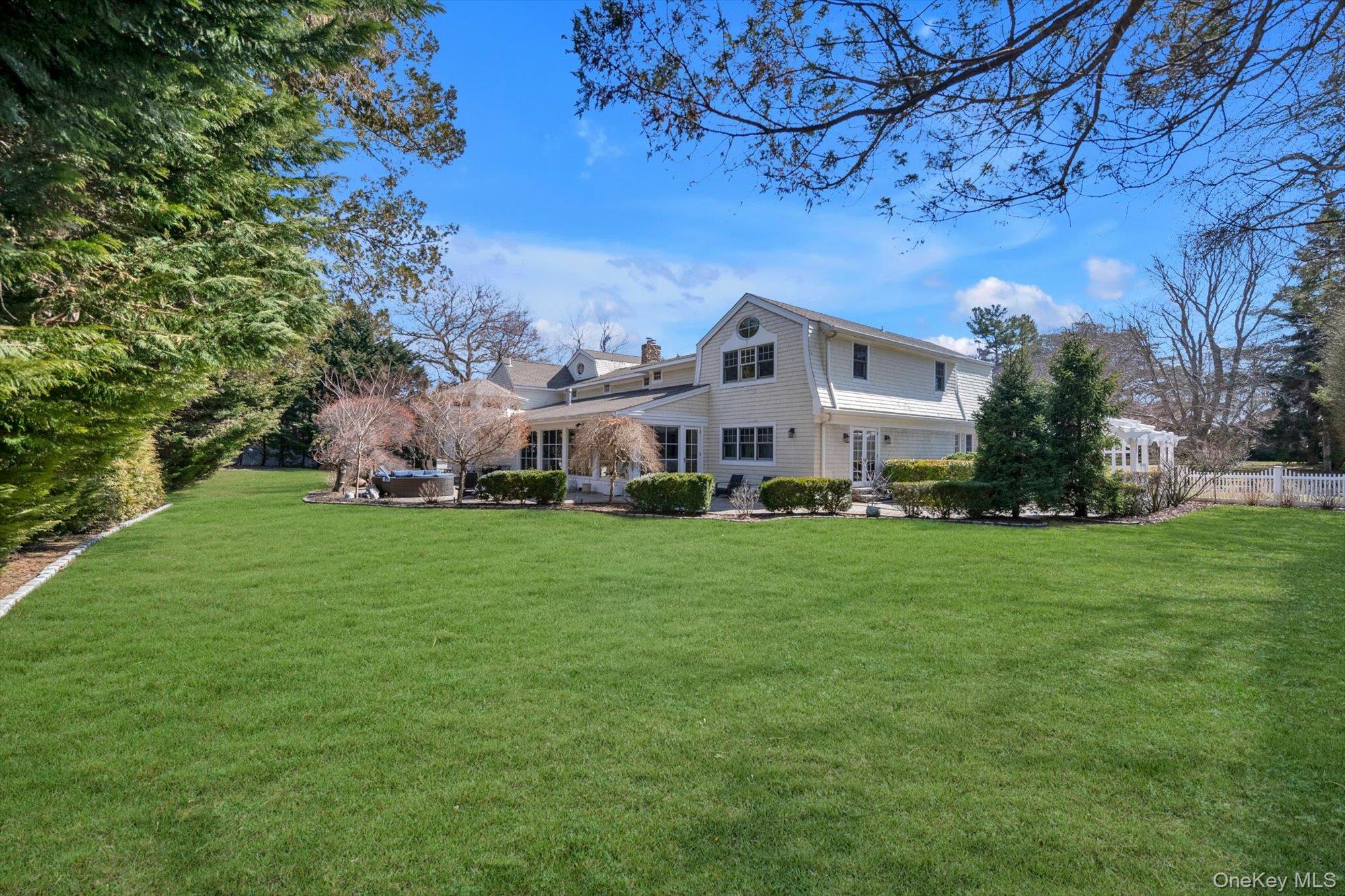 254 Adams Road Hewlett Harbor, NY 11557 - Photo 28 of 34 a view of a house with a yard