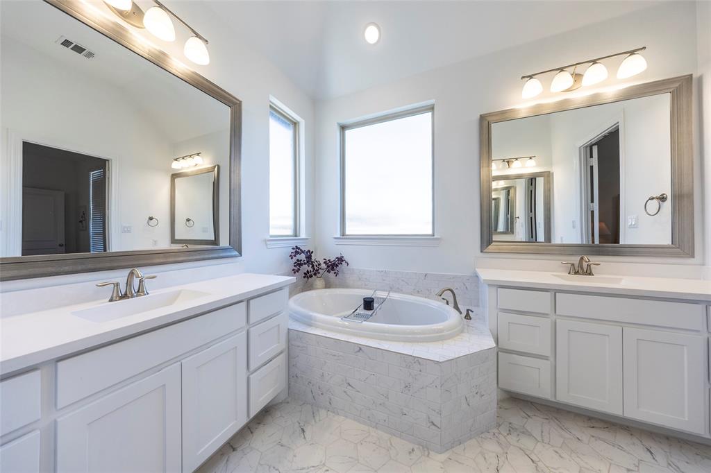 1650 Oakcrest Drive Prosper, TX 75078 - Photo 23 of 40 Full bath featuring two vanities, light marble finish flooring, a bath, and recessed lighting