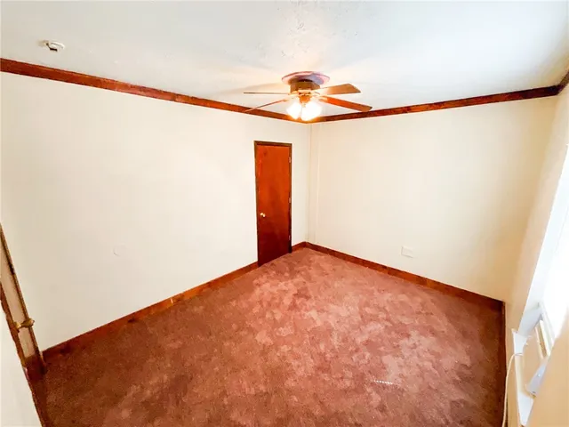 a view of a room with a refrigerator