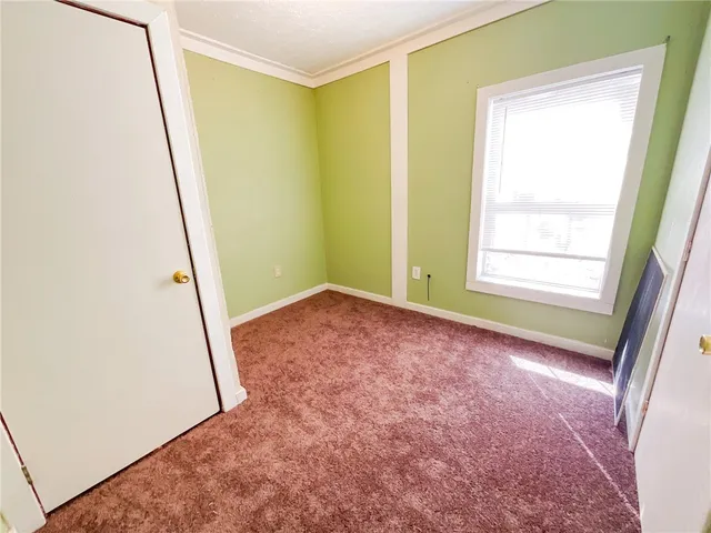 a view of room with window and stairs