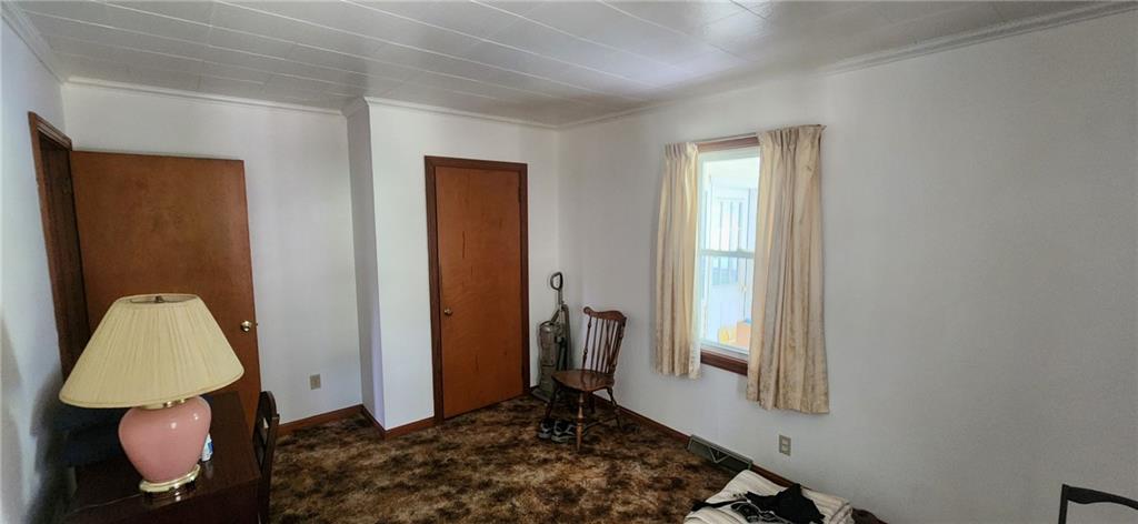 1677 Mercer Road Ellwood City, PA 16117 - Photo 12 of 22 a bedroom with a bed and a window