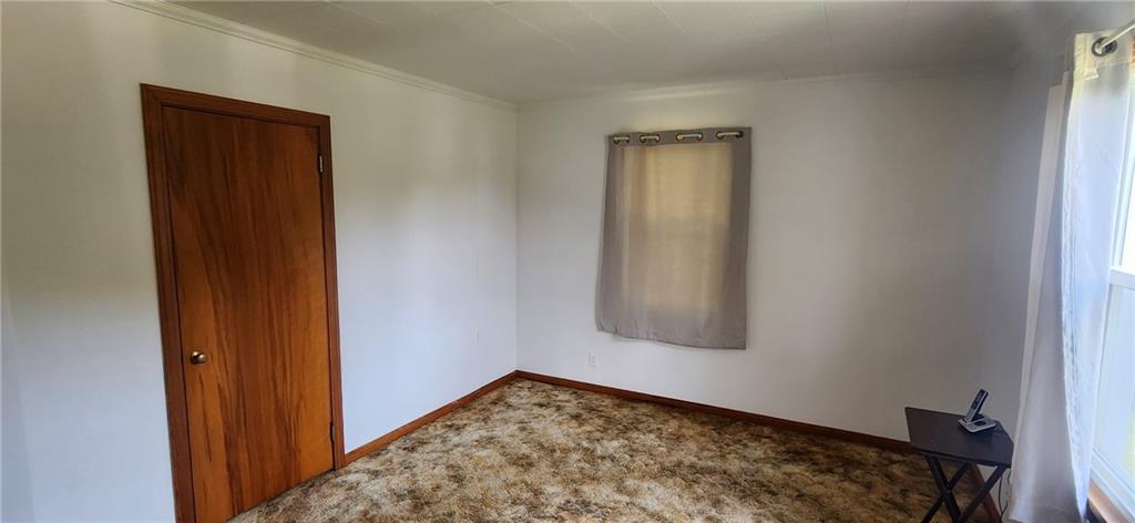 1677 Mercer Road Ellwood City, PA 16117 - Photo 15 of 22 a view of an empty room and window