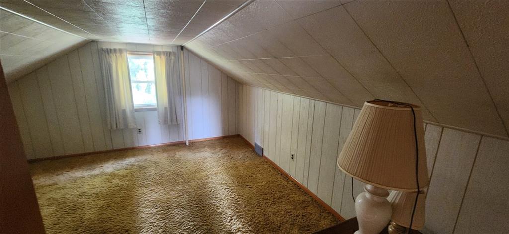 1677 Mercer Road Ellwood City, PA 16117 - Photo 20 of 22 a view of a closet with wooden floor and stairs