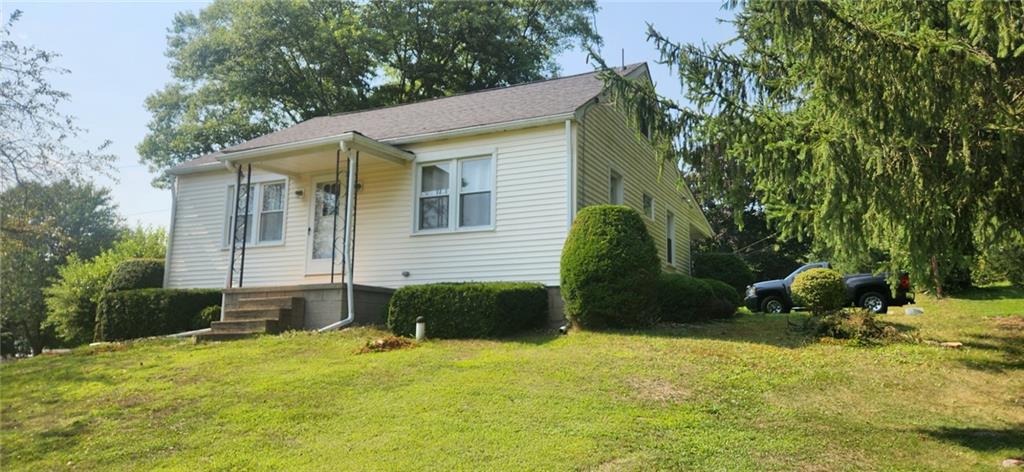 1677 Mercer Road Ellwood City, PA 16117 - Photo 2 of 22 a backyard of a house with table and chairs