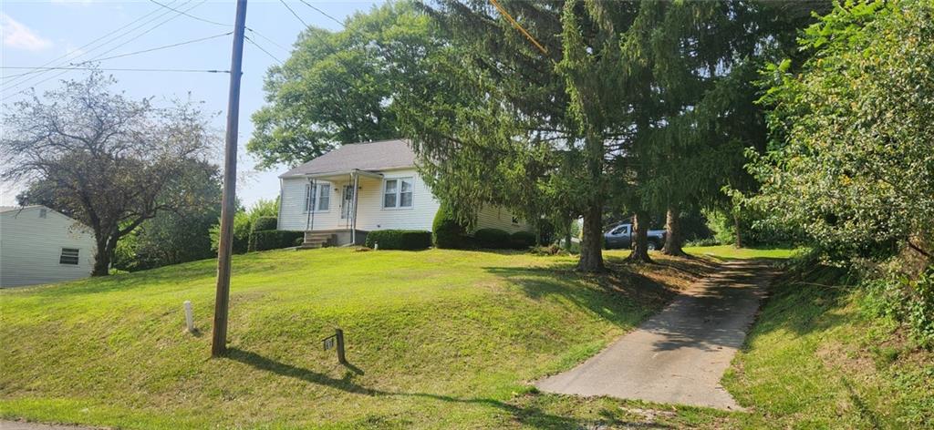 1677 Mercer Road Ellwood City, PA 16117 - Photo 3 of 22 a view of a house with backyard and tree s