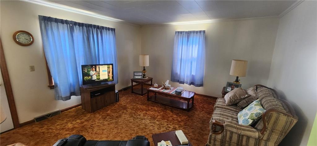 1677 Mercer Road Ellwood City, PA 16117 - Photo 7 of 22 a living room with furniture and a flat screen tv