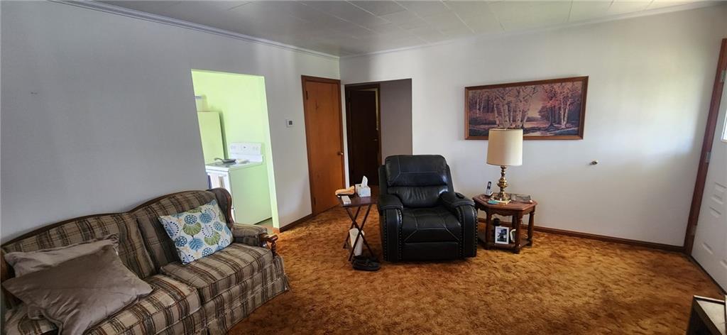1677 Mercer Road Ellwood City, PA 16117 - Photo 8 of 22 a living room with furniture and a flat screen tv