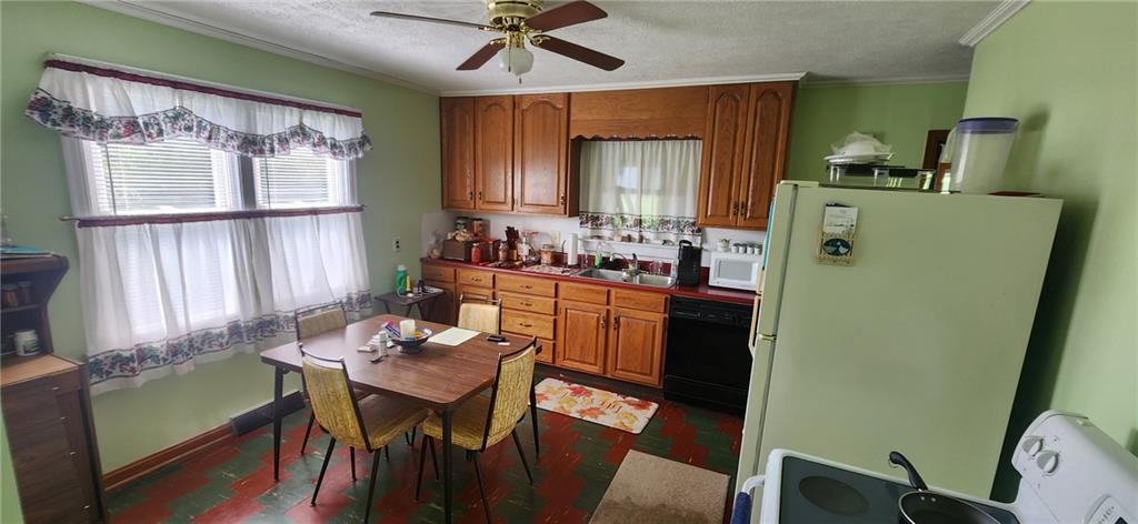 1677 Mercer Road Ellwood City, PA 16117 - Photo 9 of 22 a view of a dining room with furniture window and wooden floor