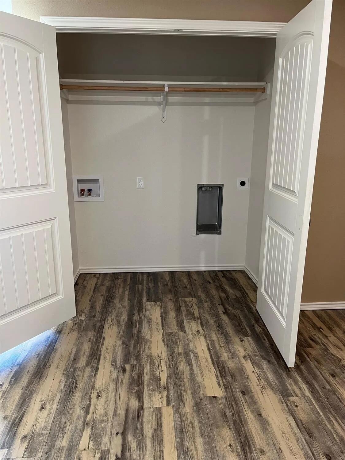 2425 N Avenue North Lubbock, TX 79403 - Photo 9 of 9 a view of a room with wooden floor and white walls