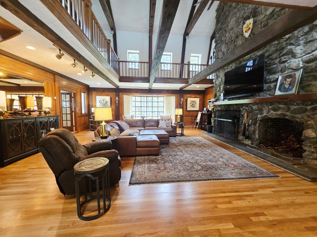 28 Pineswamp Road Ipswich, MA 01938 - Photo 11 of 42 a living room with furniture and a fireplace