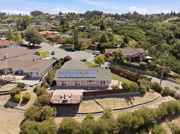 an aerial view of a house with a garden