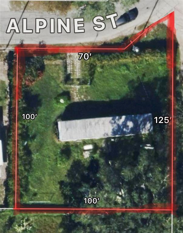 659 Alpine Street Mascotte, FL 34753 - Photo 1 of 1 a sign that is on the side of the road
