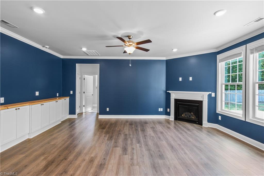 2071 Spring Wind Road Pfafftown, NC 27040 - Photo 7 of 35 Great room with awesome built-ins for extra storage!