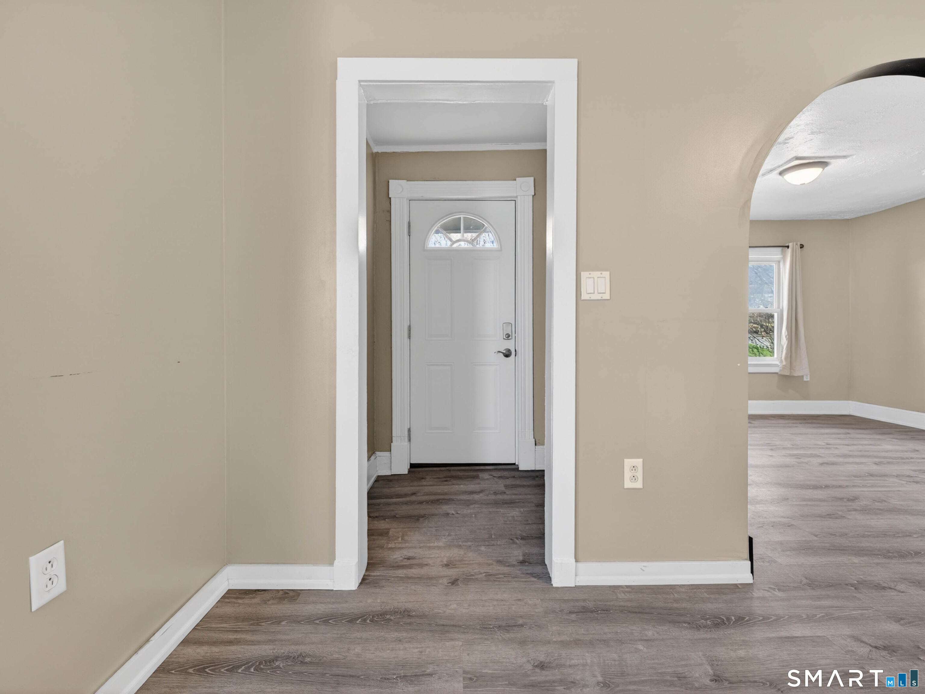97 Woodland Street Meriden, CT 06451 - Photo 11 of 35 an empty room with wooden floor and a window