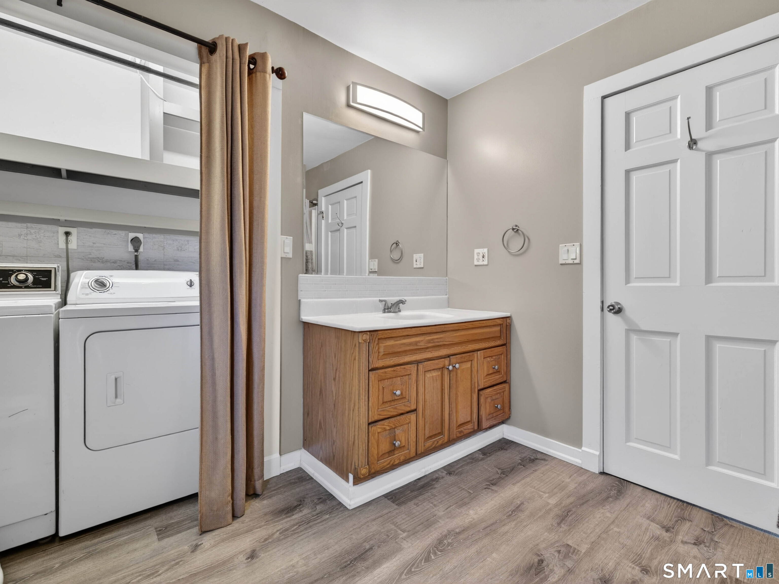 97 Woodland Street Meriden, CT 06451 - Photo 18 of 35 a room with a sink cabinets and a mirror