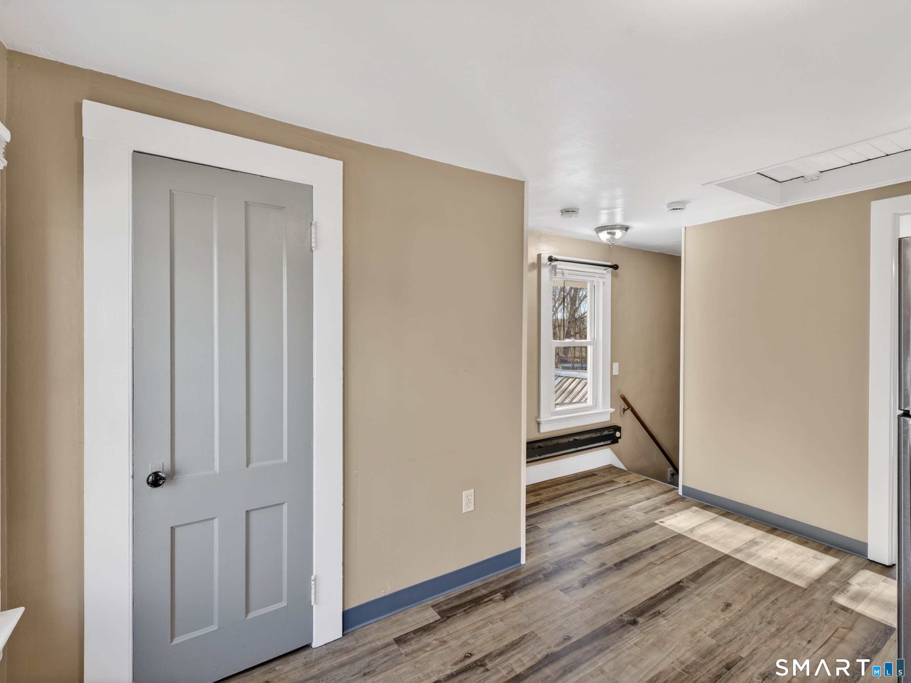 97 Woodland Street Meriden, CT 06451 - Photo 23 of 35 a view of a hallway with wooden floor and closet area
