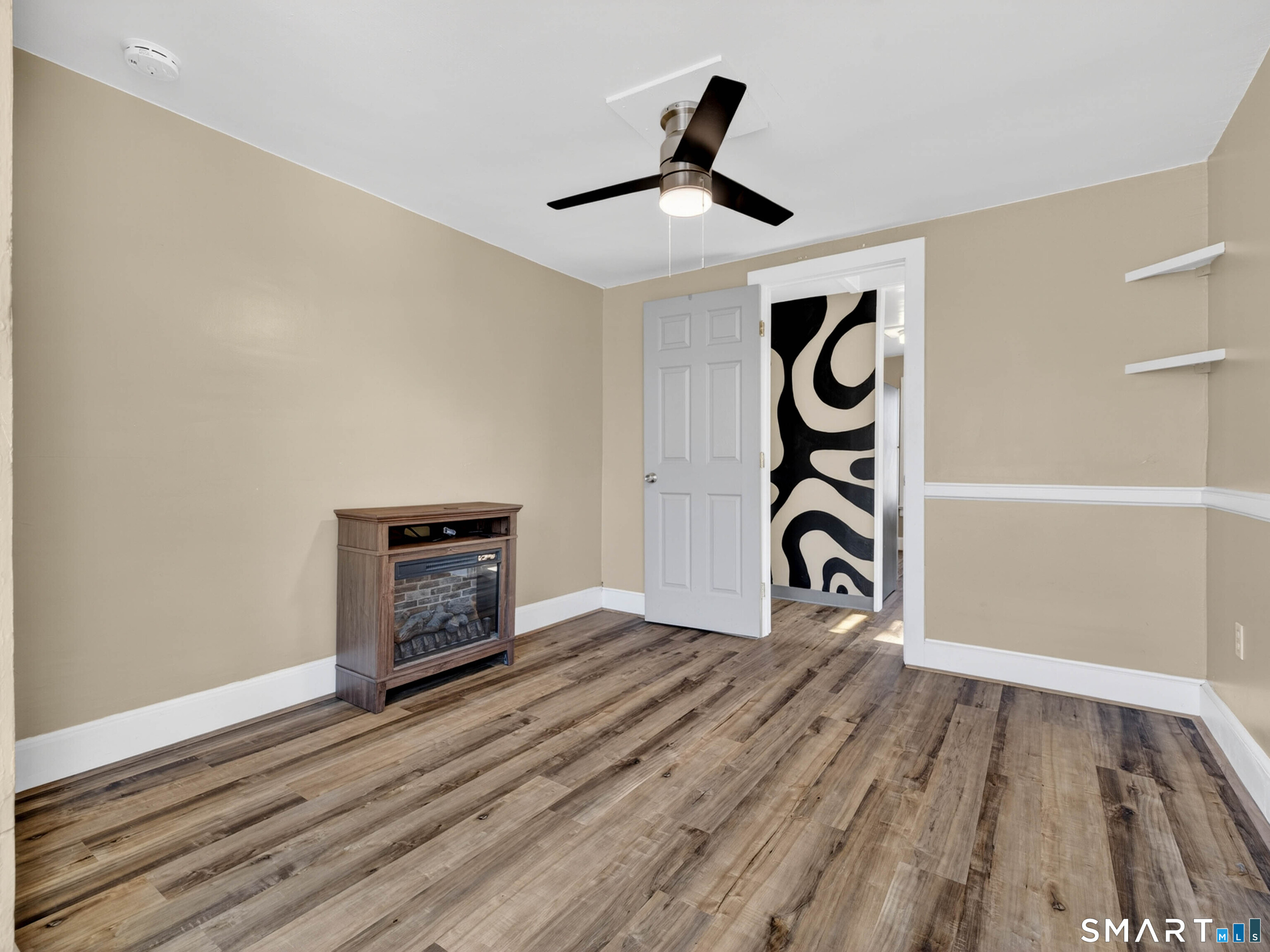 97 Woodland Street Meriden, CT 06451 - Photo 26 of 35 a view of an empty room and wooden floor