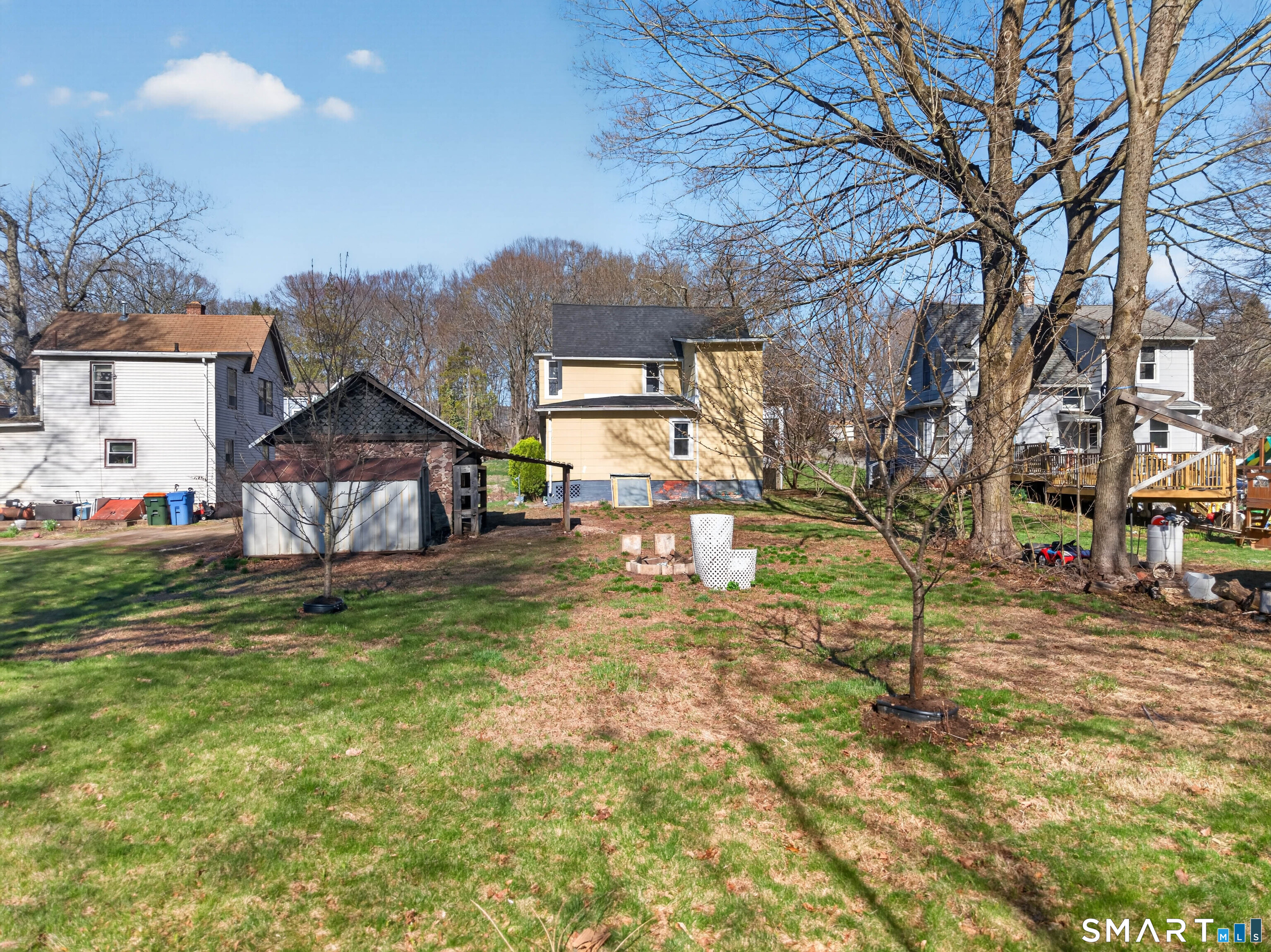 97 Woodland Street Meriden, CT 06451 - Photo 28 of 35 a backyard of a house with table and chairs