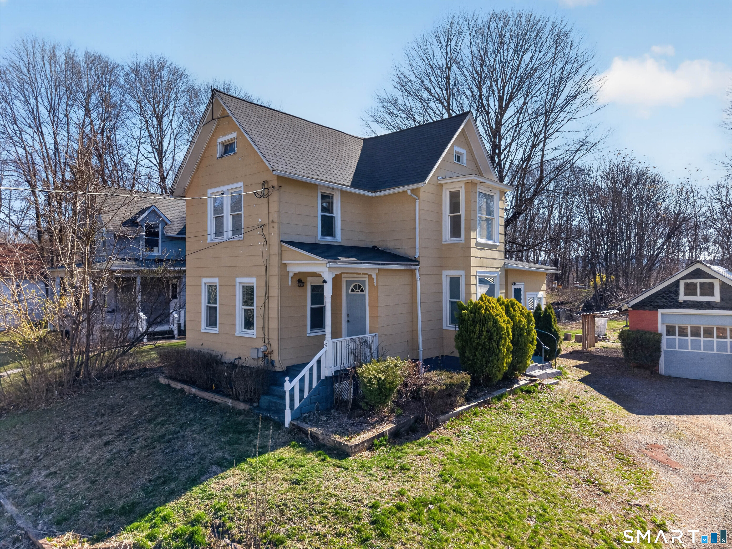 97 Woodland Street Meriden, CT 06451 - Photo 33 of 35 a front view of a house with garden