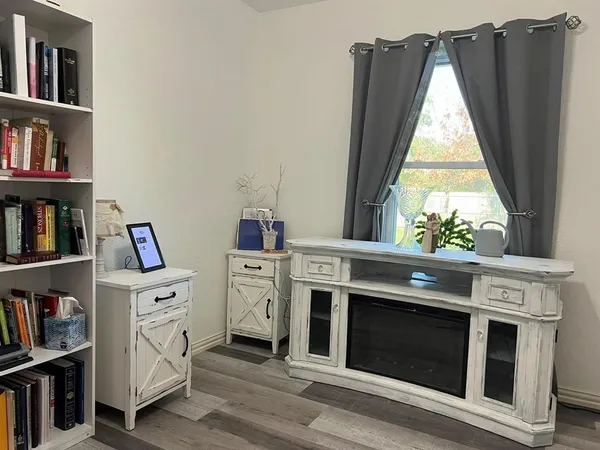 a kitchen with white cabinets and a stove