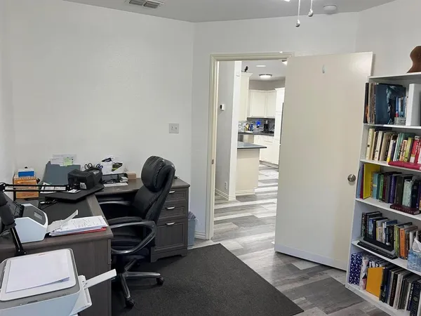 a workspace with a bookshelf and a workspace