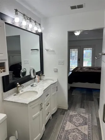 a bathroom with a sink double vanity and a mirror
