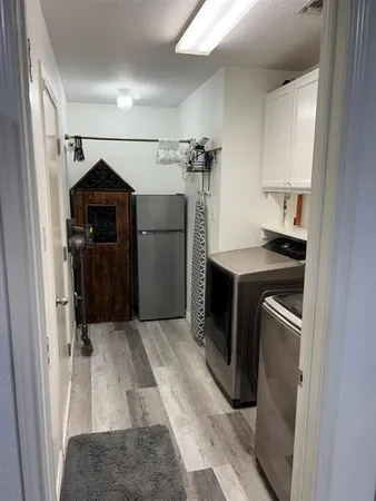 a utility room with washer and dryer