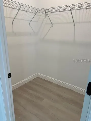 a view of a room with racks on the wall