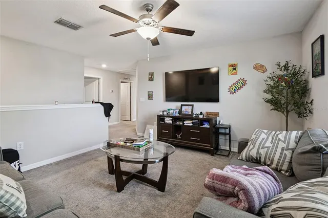 a bedroom with bed and window