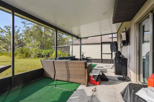 an aerial view of residential houses with outdoor space and swimming pool