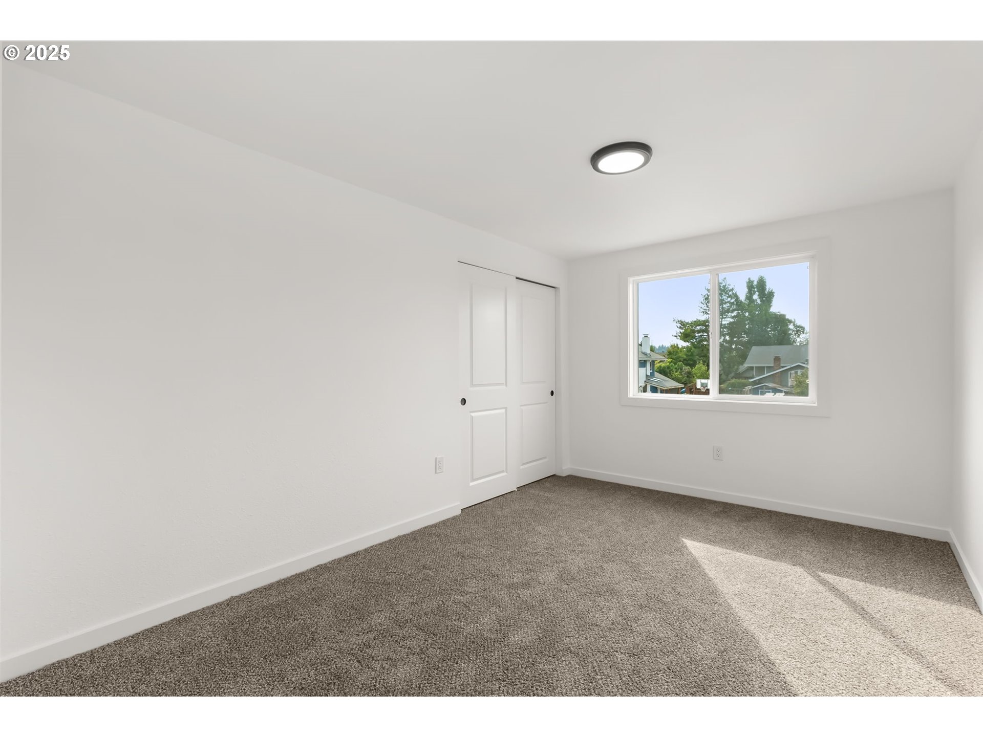 487 72nd Street Springfield, OR 97478 - Photo 11 of 23 an empty room with windows and bed