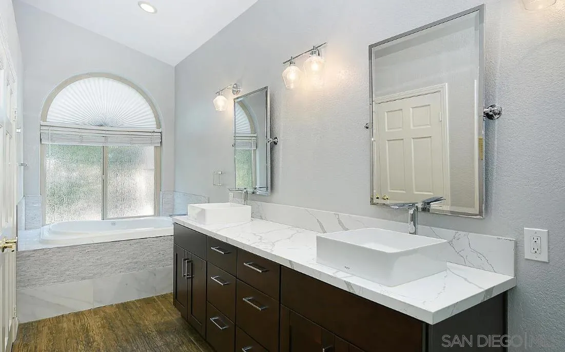 14525 Millards Ranch Lane Poway, CA 92064 - Photo 21 of 29 a bathroom with 2 sink and a mirror