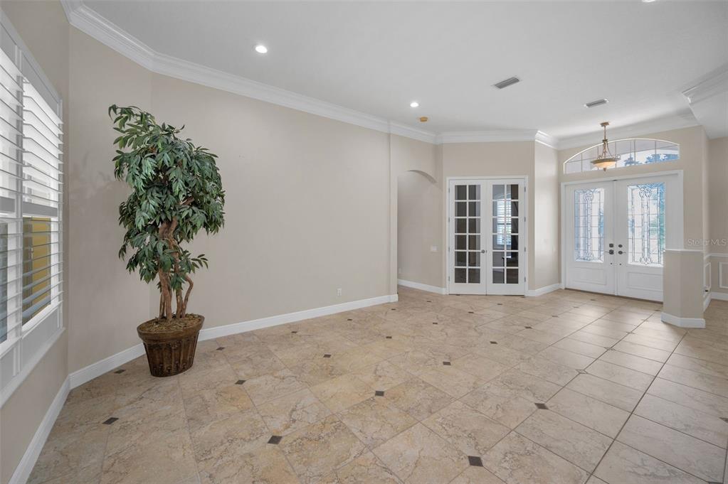 1227 Toscano Drive Trinity, FL 34655 - Photo 11 of 99 a view of a livingroom with a potted plant