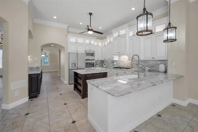 a white bath tub sitting in a bathroom next to a window