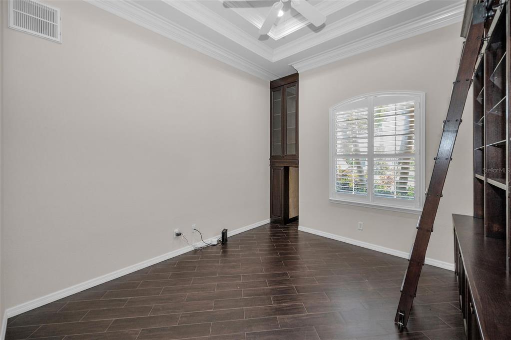1227 Toscano Drive Trinity, FL 34655 - Photo 39 of 99 wooden floor in an empty room with a window