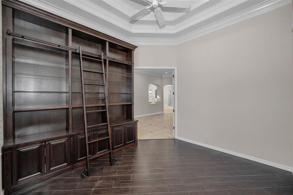 1227 Toscano Drive Trinity, FL 34655 - Photo 40 of 99 a view of an empty room with wooden floor and a window