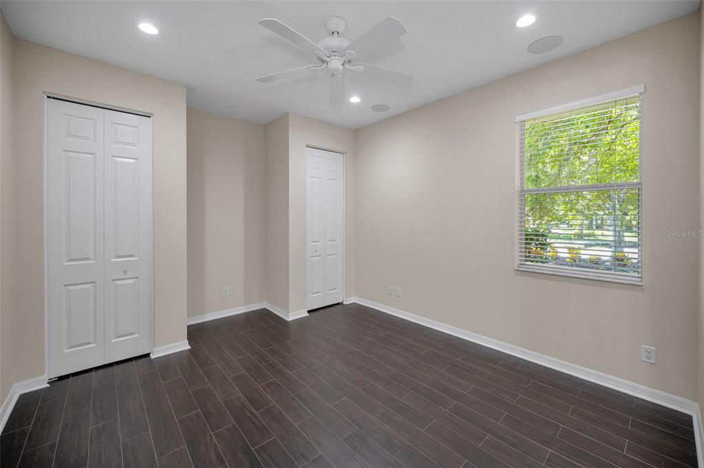 1227 Toscano Drive Trinity, FL 34655 - Photo 43 of 99 an empty room with wooden floor and windows