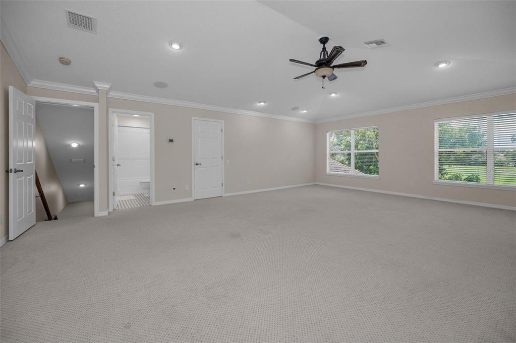 1227 Toscano Drive Trinity, FL 34655 - Photo 53 of 99 an empty room with windows and ceiling fan