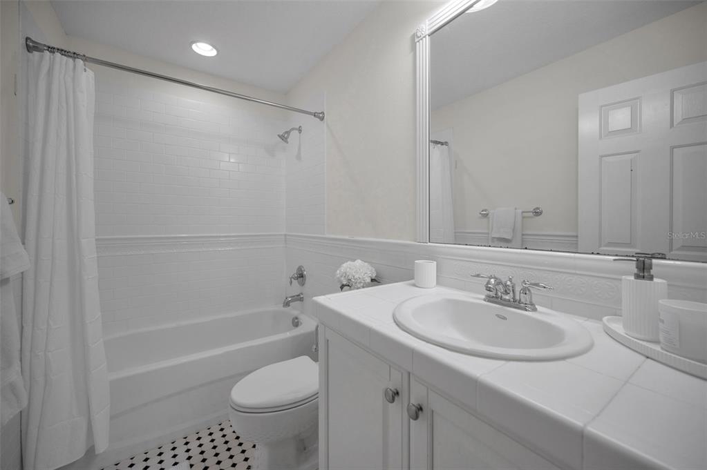 1227 Toscano Drive Trinity, FL 34655 - Photo 54 of 99 a bathroom with a sink toilet and shower