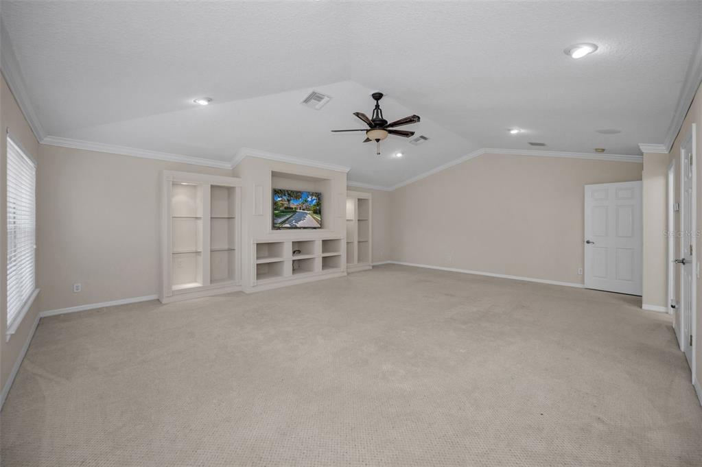 1227 Toscano Drive Trinity, FL 34655 - Photo 56 of 99 an empty room with a empty space and a ceiling fan