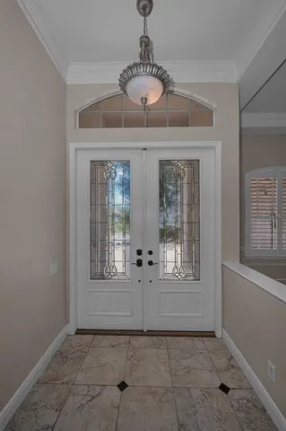 a kitchen with granite countertop white cabinets and stainless steel appliances