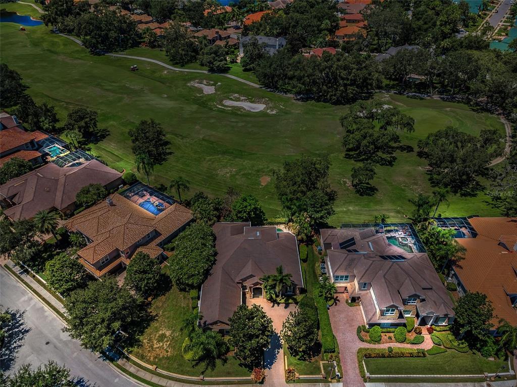 1227 Toscano Drive Trinity, FL 34655 - Photo 84 of 99 an aerial view of residential houses with outdoor space and street view