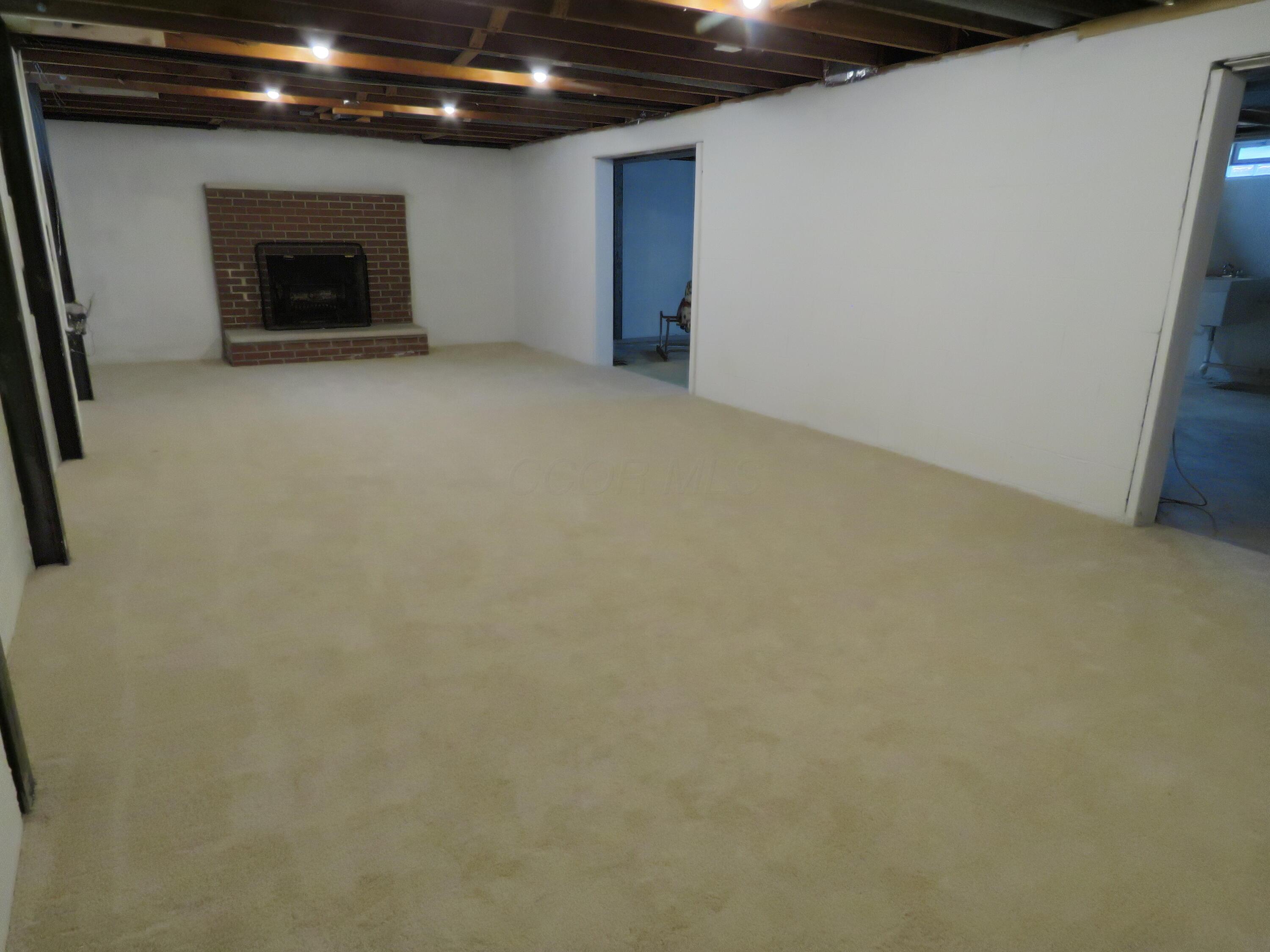 3668 Ridgewood Drive Hilliard, OH 43026 - Photo 35 of 44 Big rec room with fireplace.