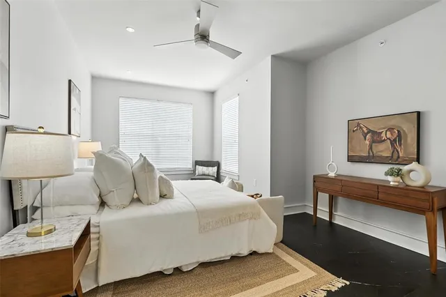 a bedroom with a bed and a table in it