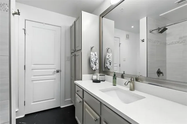 a bathroom with a sink and a mirror